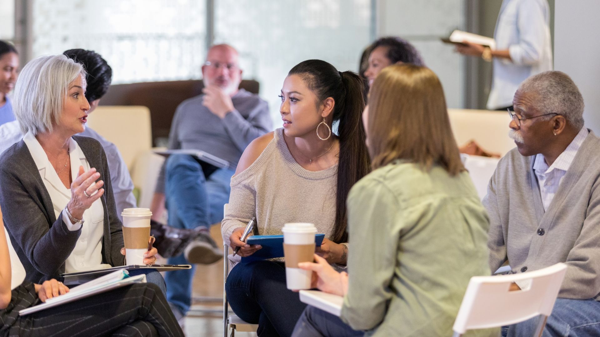 people talking in a group setting