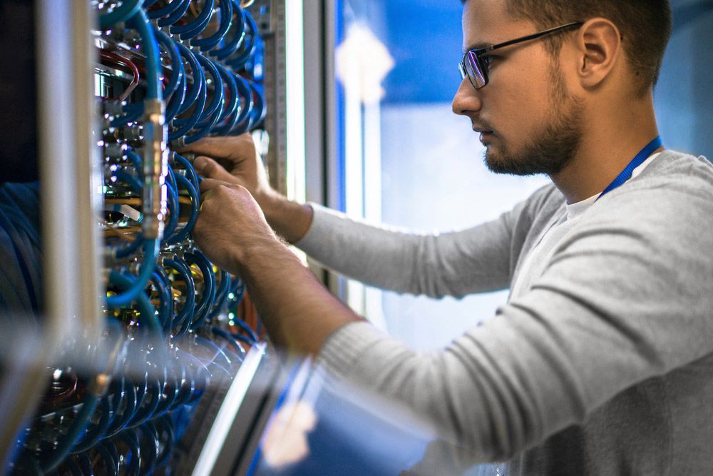 Guys Working on Network Panel — Communication Systems in Lake Macquarie, NSW