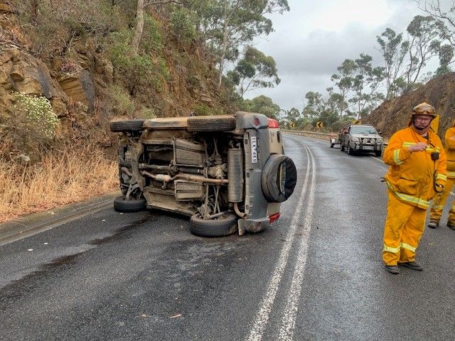 A Red Car Is Being Towed By A Tow Truck — Lorne Accident & Assist Towing In Eastern View, VIC