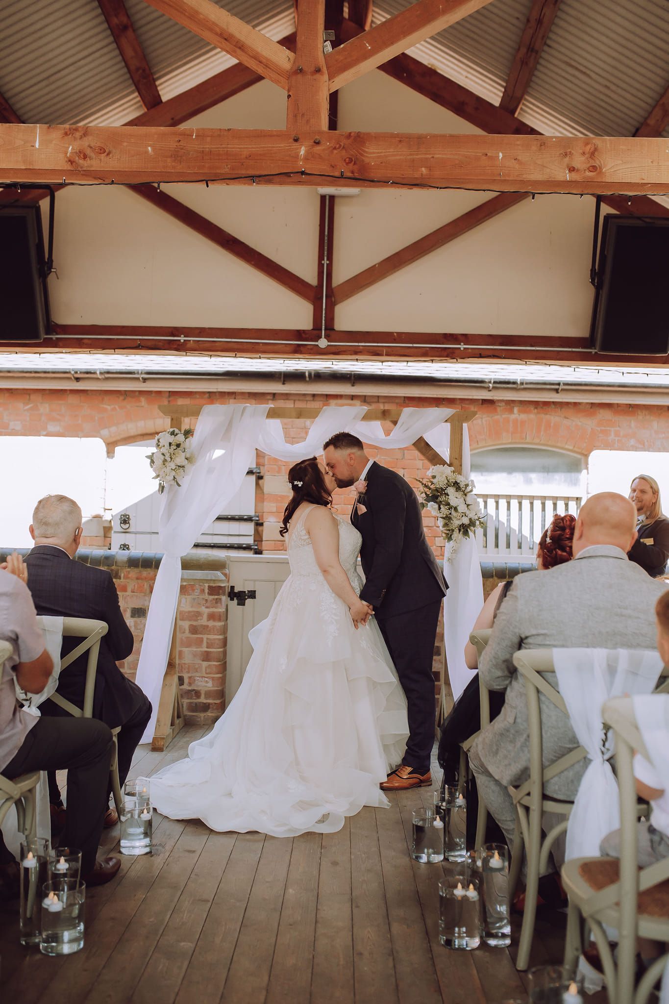 bride and groom, first, kiss, wedding aisle, chair, decor