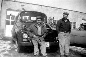 Black And White Image Of Two People Sitting In Front Of The Car | Spooner, WI | C & J Body Shop Inc. Black And White Image Of Two People Sitting In Front Of The Car | Spooner, WI | C & J Body Shop Inc.