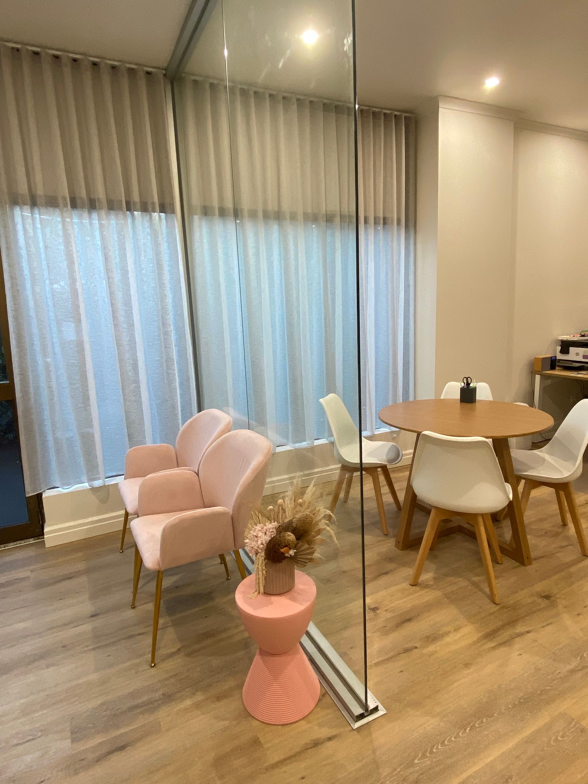 There is a table and chairs in the room.