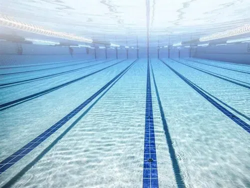 An underwater view of a swimming pool with a lot of lanes.