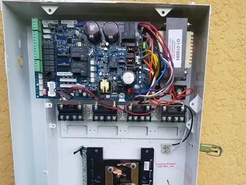The inside of a box with a lot of wires coming out of it