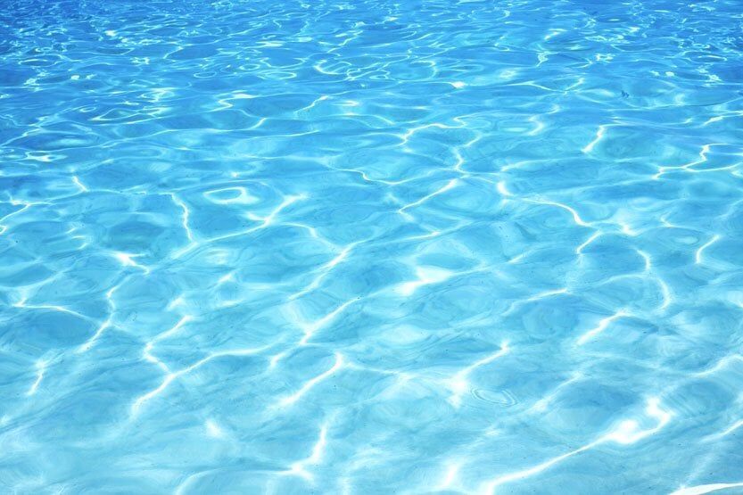 A close up of a swimming pool with blue water