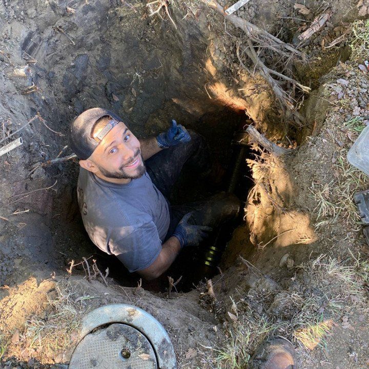 Plumber fixing the pipe