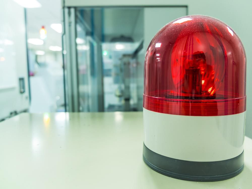 A Red and White Emergency Light Is Sitting on A Table — Stellar Test and Tag in Gunnedah, NSW