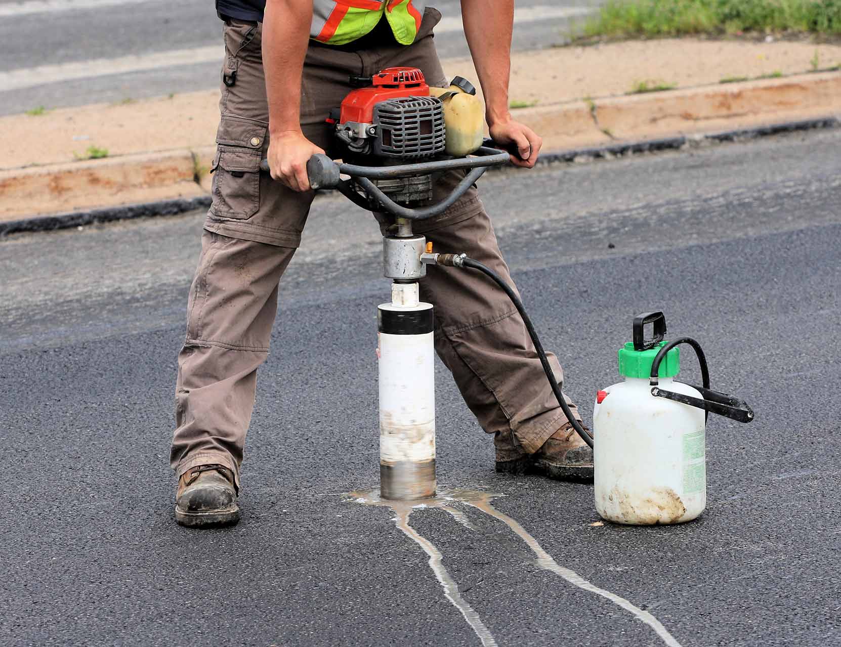 Getting a Sample of Asphalt — Albuquerque, NM — Earthworks Engineering Group LLC Getting a Sample of Asphalt — Albuquerque, NM — Earthworks Engineering Group LLC