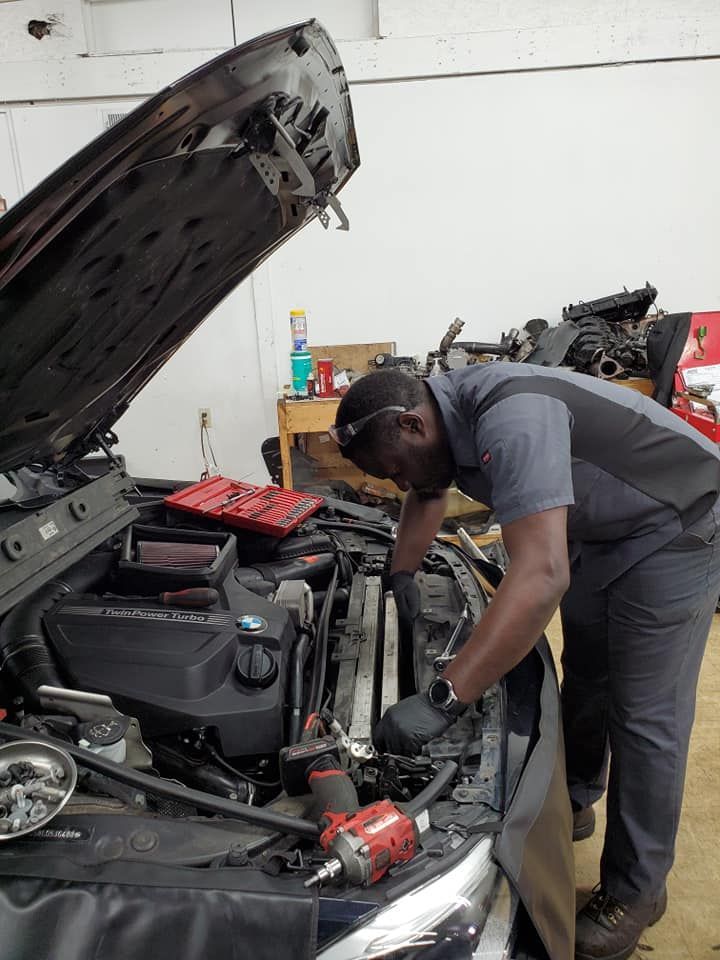 Man Repairing A Car