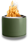 A green fire pit with a fire coming out of it.