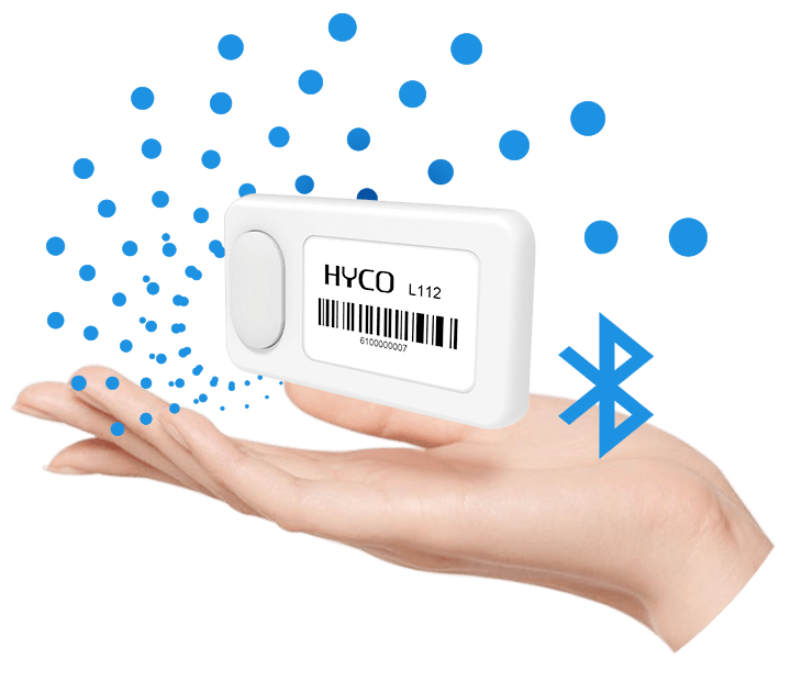 A hand is holding a device that L112 Button-On Wireless Light Tag
