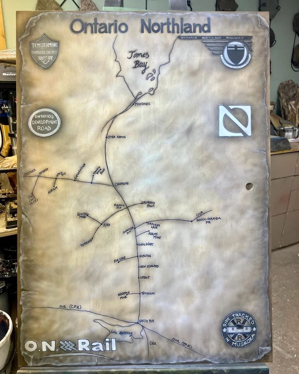 A map of ontario northland on a wooden board
