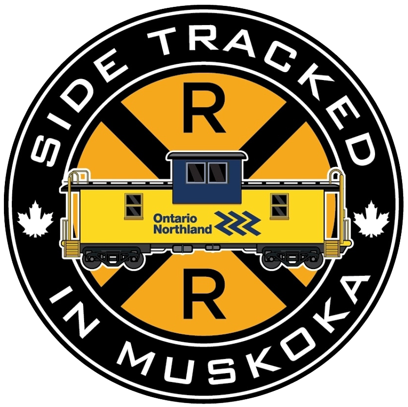 A logo for side tracked in muskoka with a yellow train