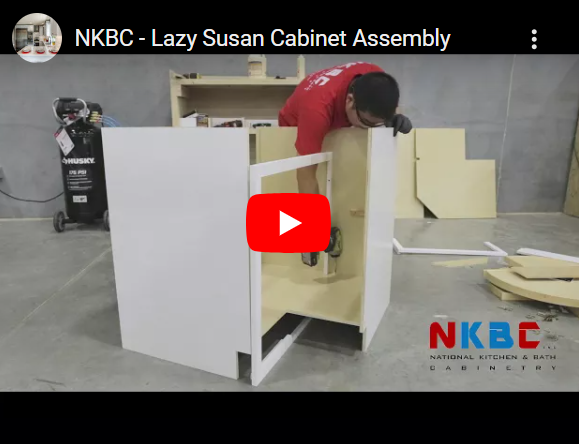 A cabinet with the door open and a drawer in it
