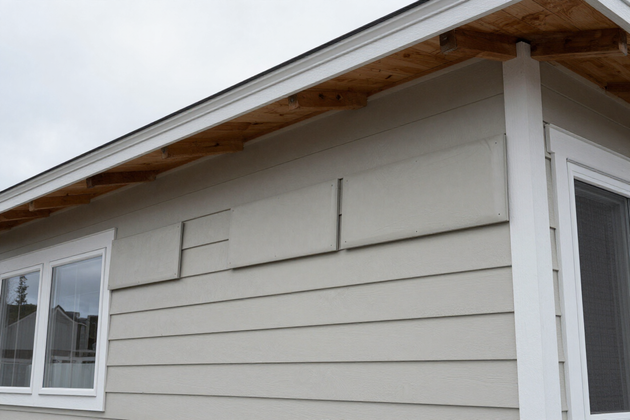 Siding replacement project with fiber cement panels being installed on a Northwest home.