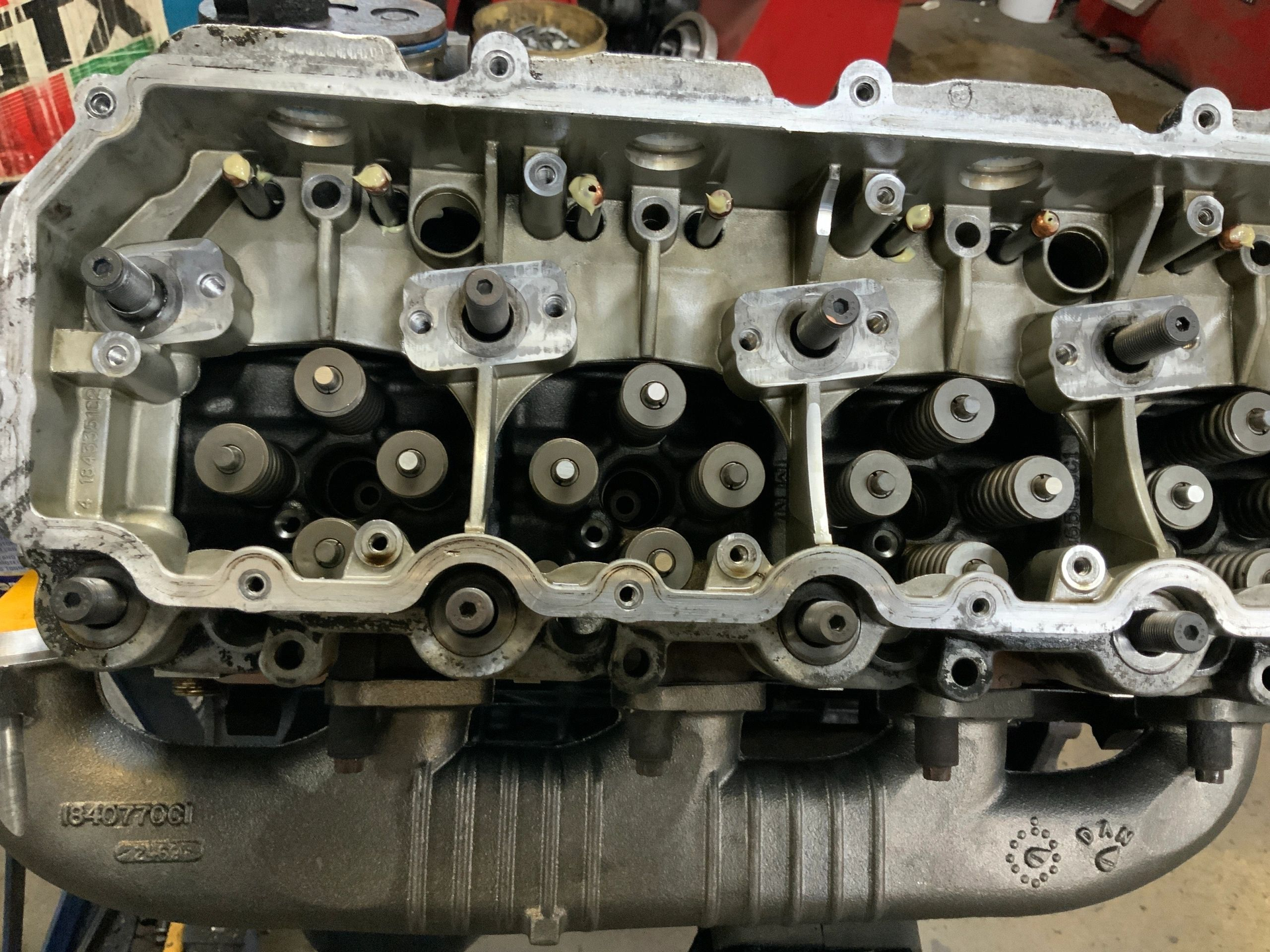 A close up of a cylinder head of a car engine. | North County Service Center