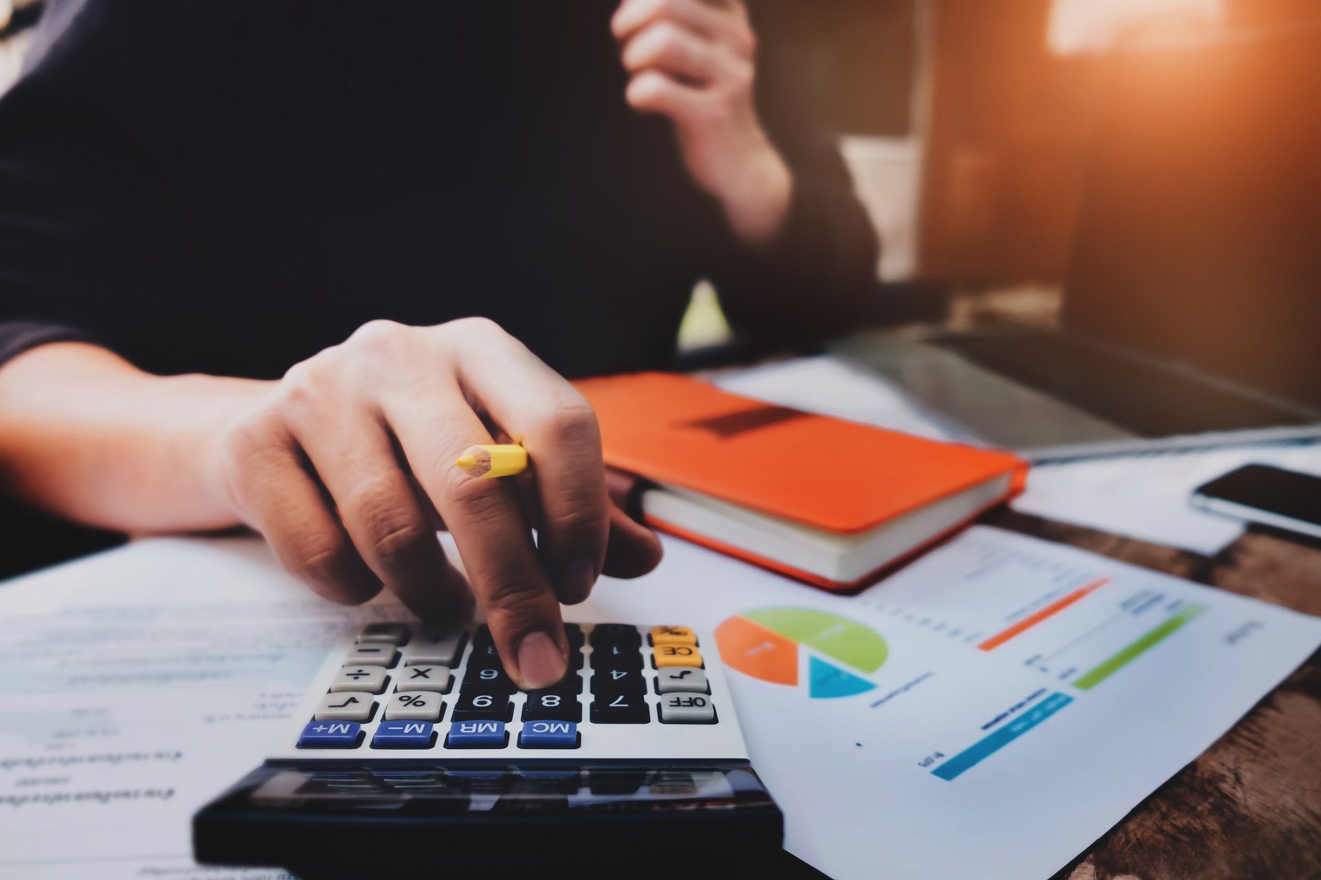 Computing Calculator With Orange Notebook — Mcdonough, GA — Middle Georgia Accounting and Tax