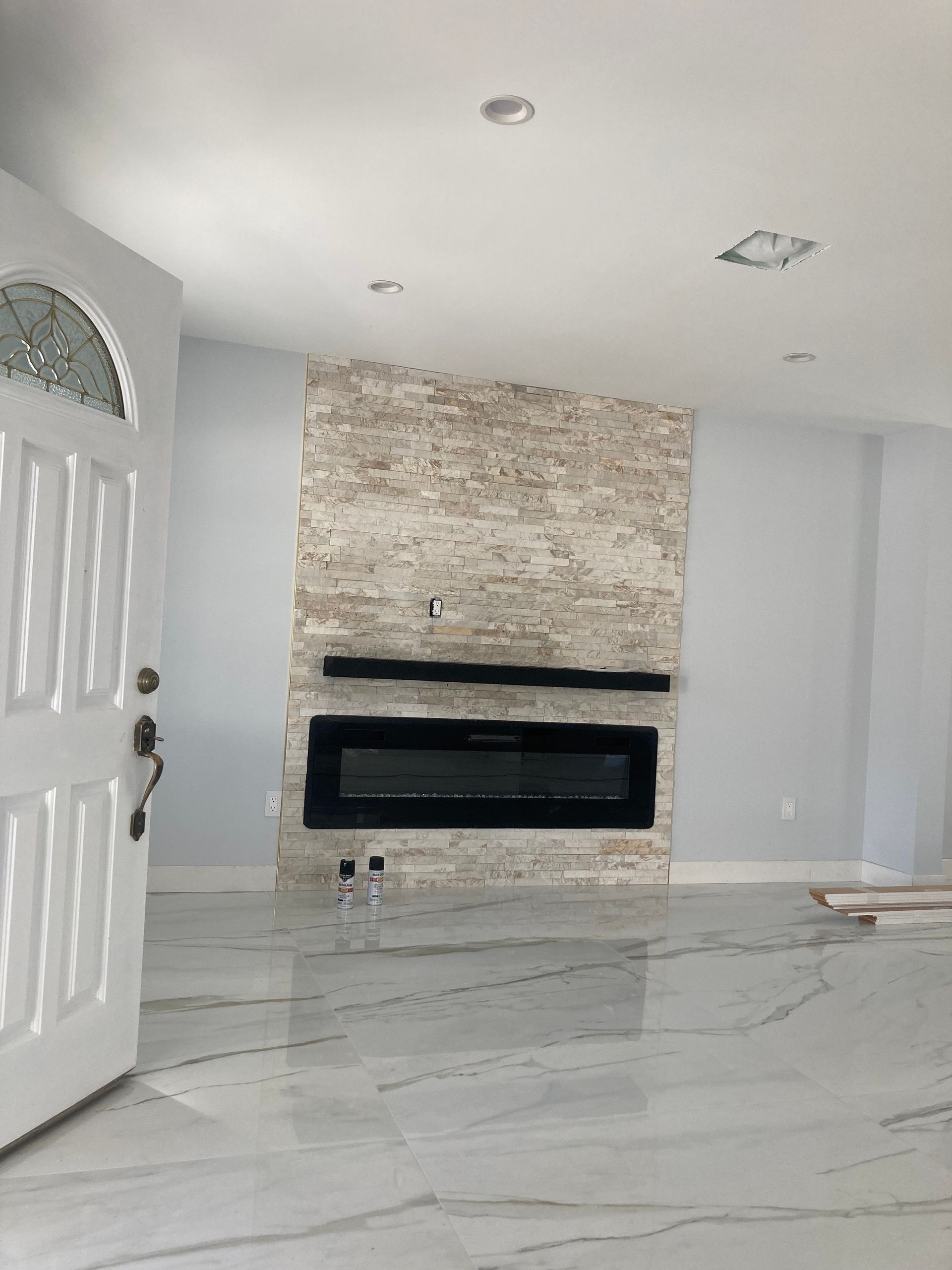 There is a fireplace in the middle of the room.