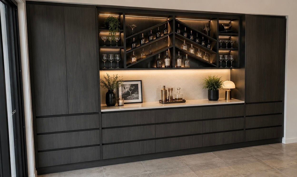 Black built-in cabinet with shelves, decor, and warm backlit display in a modern room