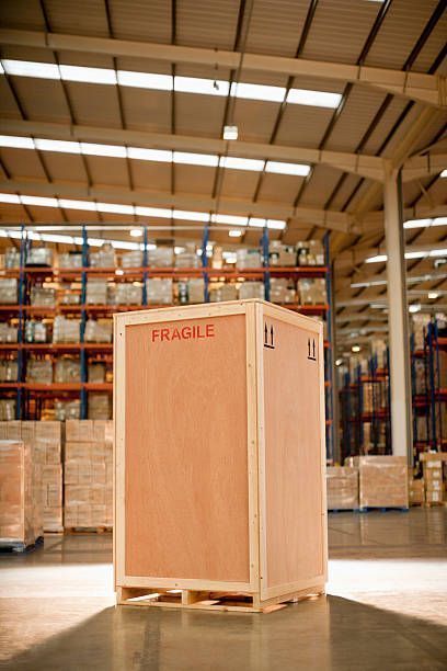 Large wooden shipping crate on a pallet, labeled