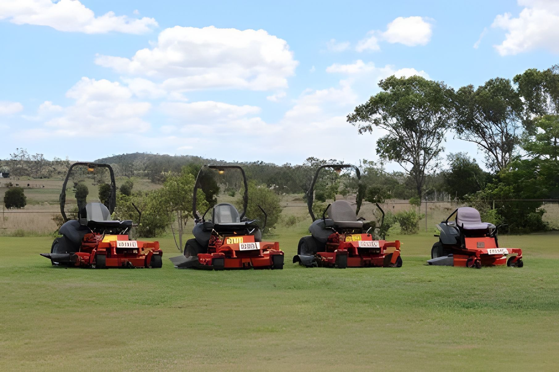 Four lwn Mowers are Parked in a Grassy Field — Wetzler Pty Ltd In Marmor QLD
