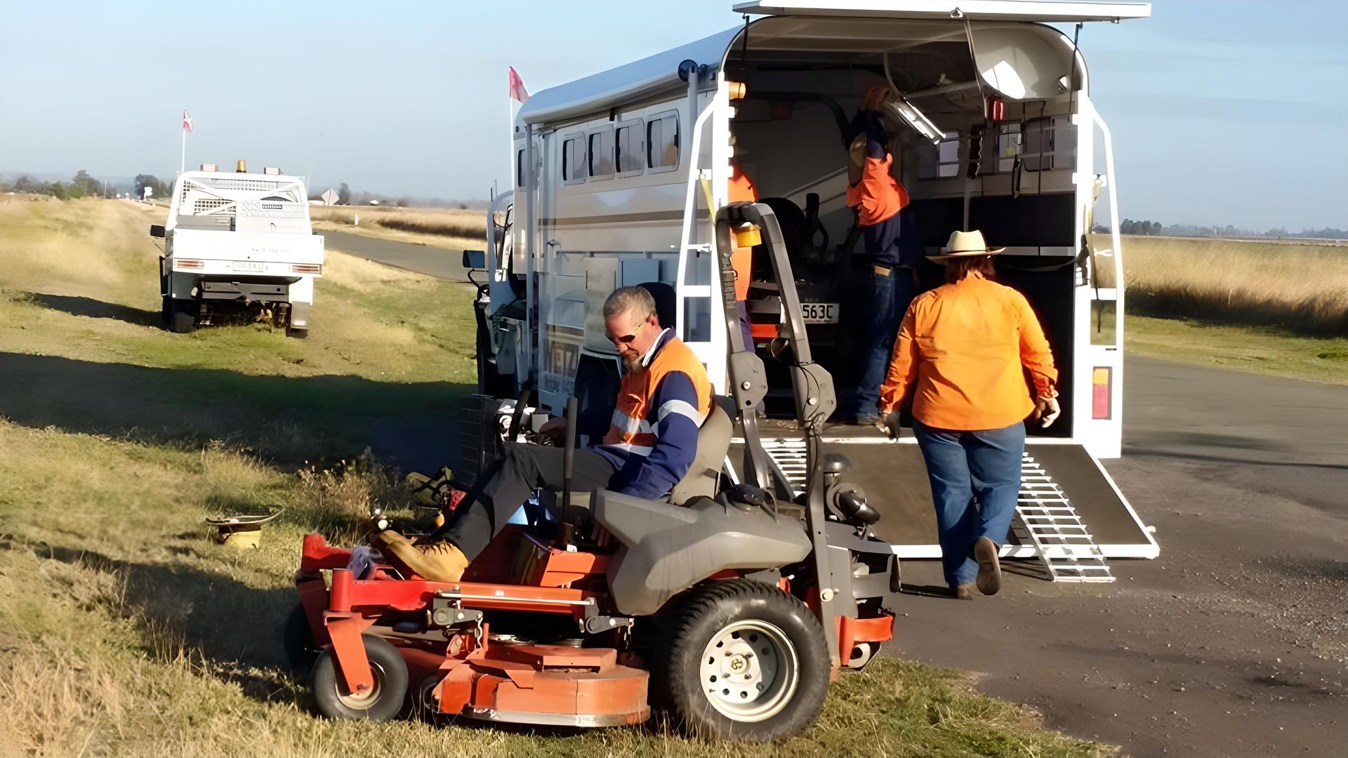 Four Wetzler Worker in Uniform in the grass Land — Wetzler Pty Ltd In Marmor QLD