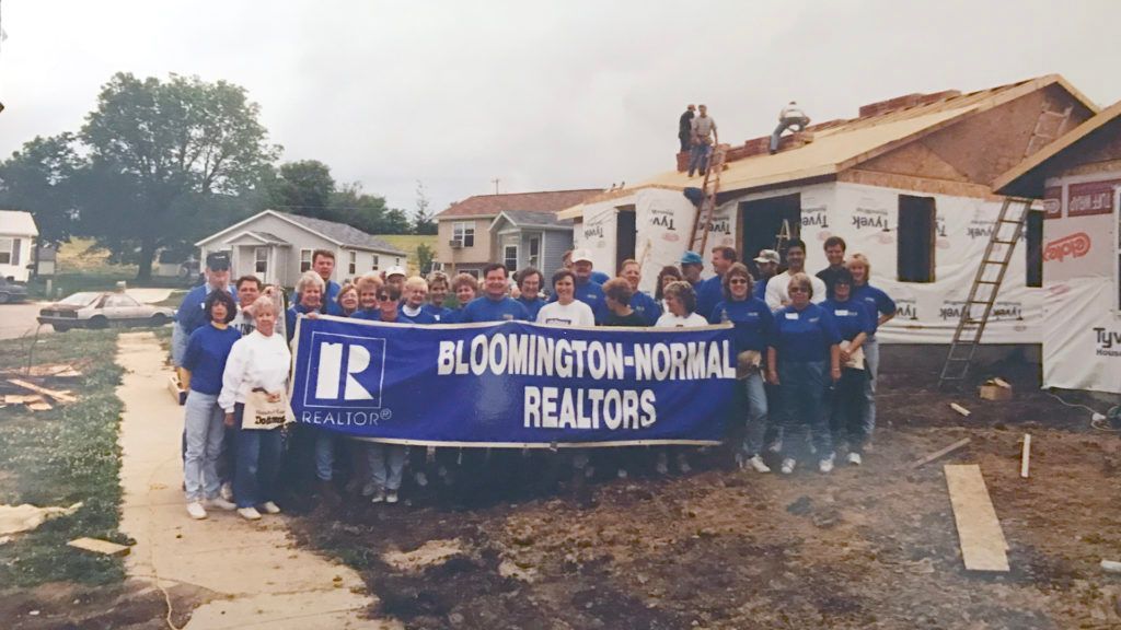 a group of people holding a banner