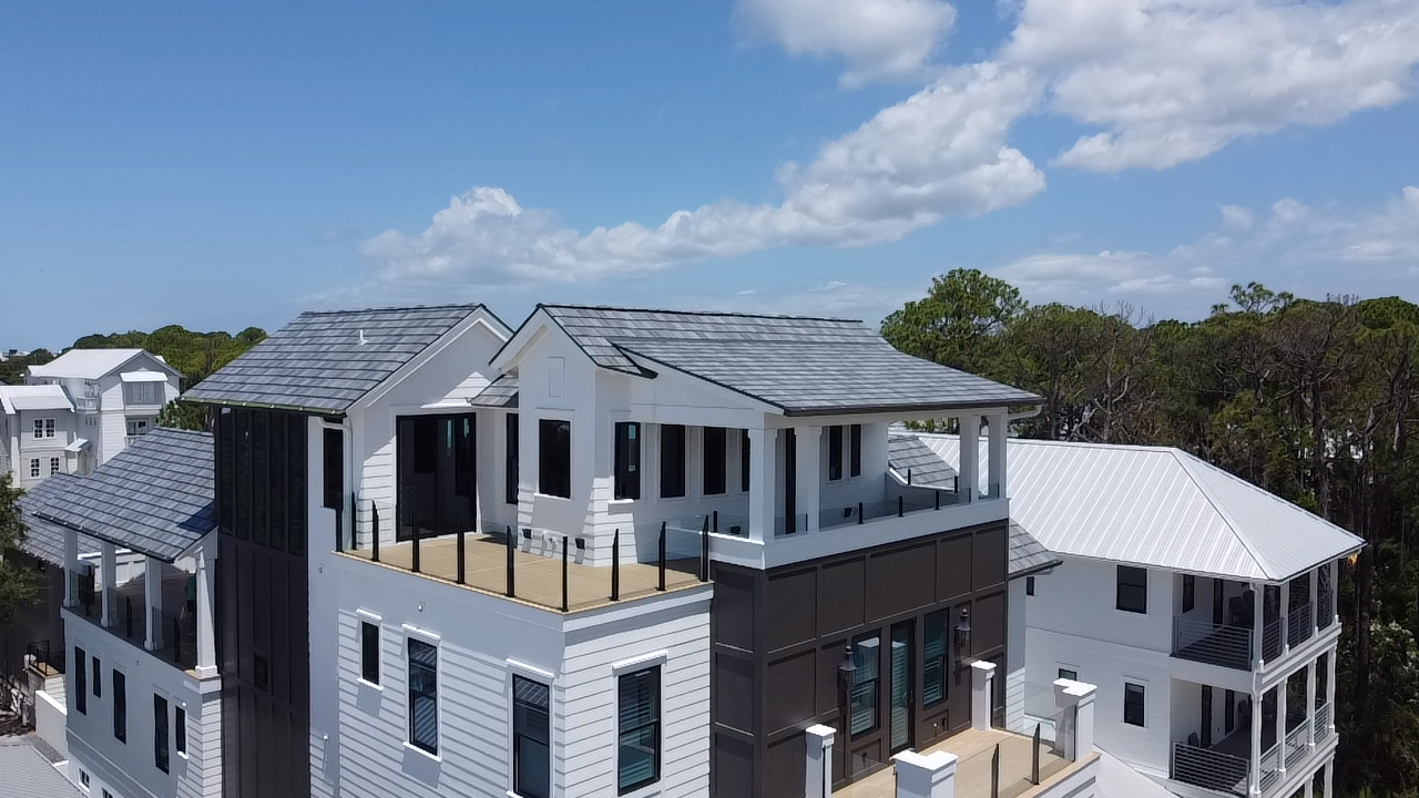 Duradek waterproof vinyl decking installed on an elevated porch in Panama City Florida