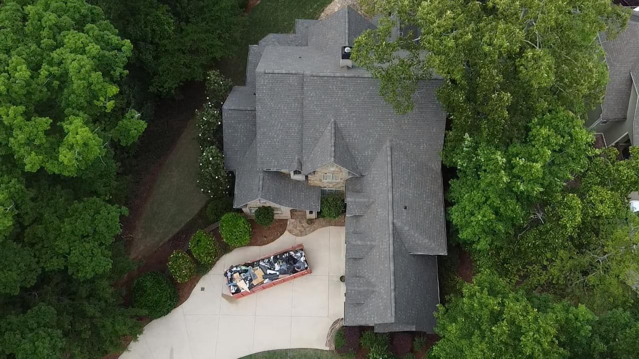 Roofing crew replacing a weather-damaged roof on a Mexico Beach, Florida home