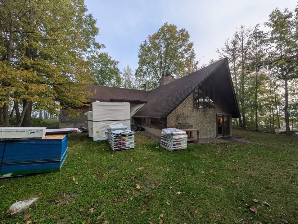 Original double A-frame cabin exterior before renovation in Wright, MN