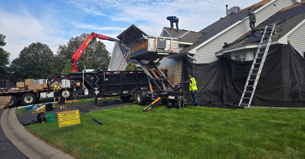 Reroofing project in progress at a muiltifamily HOA townhome community.