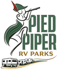Pied Piper RV Parks logo with stylized piper, green lettering, and RVs on a road.