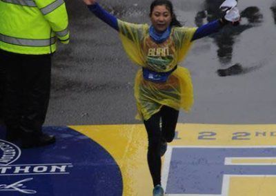 A woman wearing a shirt that says run on it