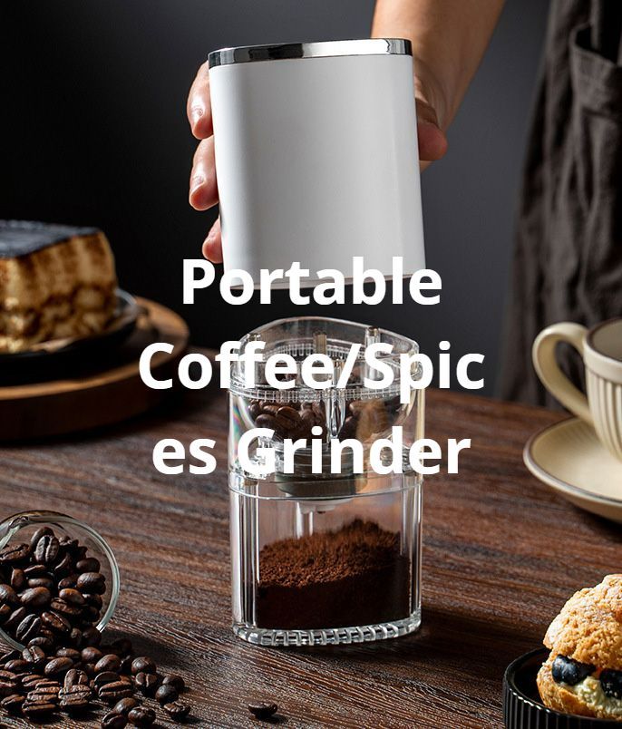 Person holding white and silver portable coffee/spice grinder, with beans and ground coffee visible.