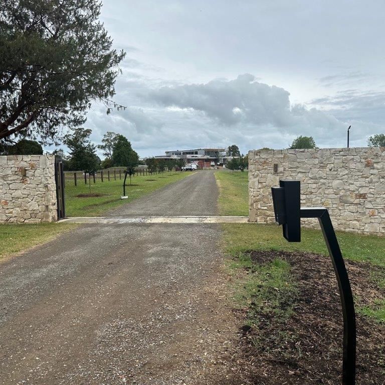 A Stone Gate With a Keypad on the Driveway — CTE Systems In Tuncurry, NSW