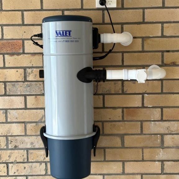 Wall-mounted Vacuum System Installed on a Brick Wall — CTE Systems In Tuncurry, NSW