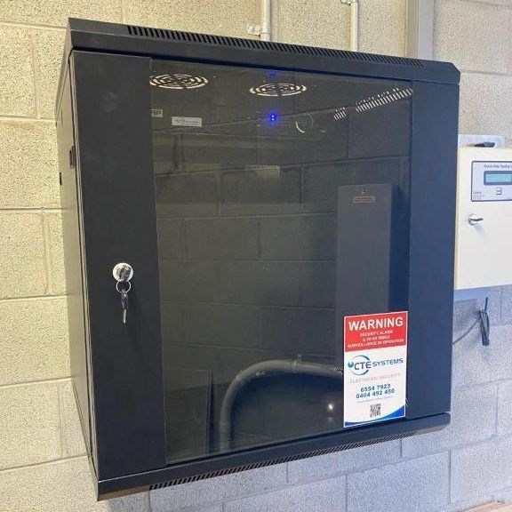 A Locked Electric Box With a Warning Sign — CTE Systems In Tuncurry, NSW