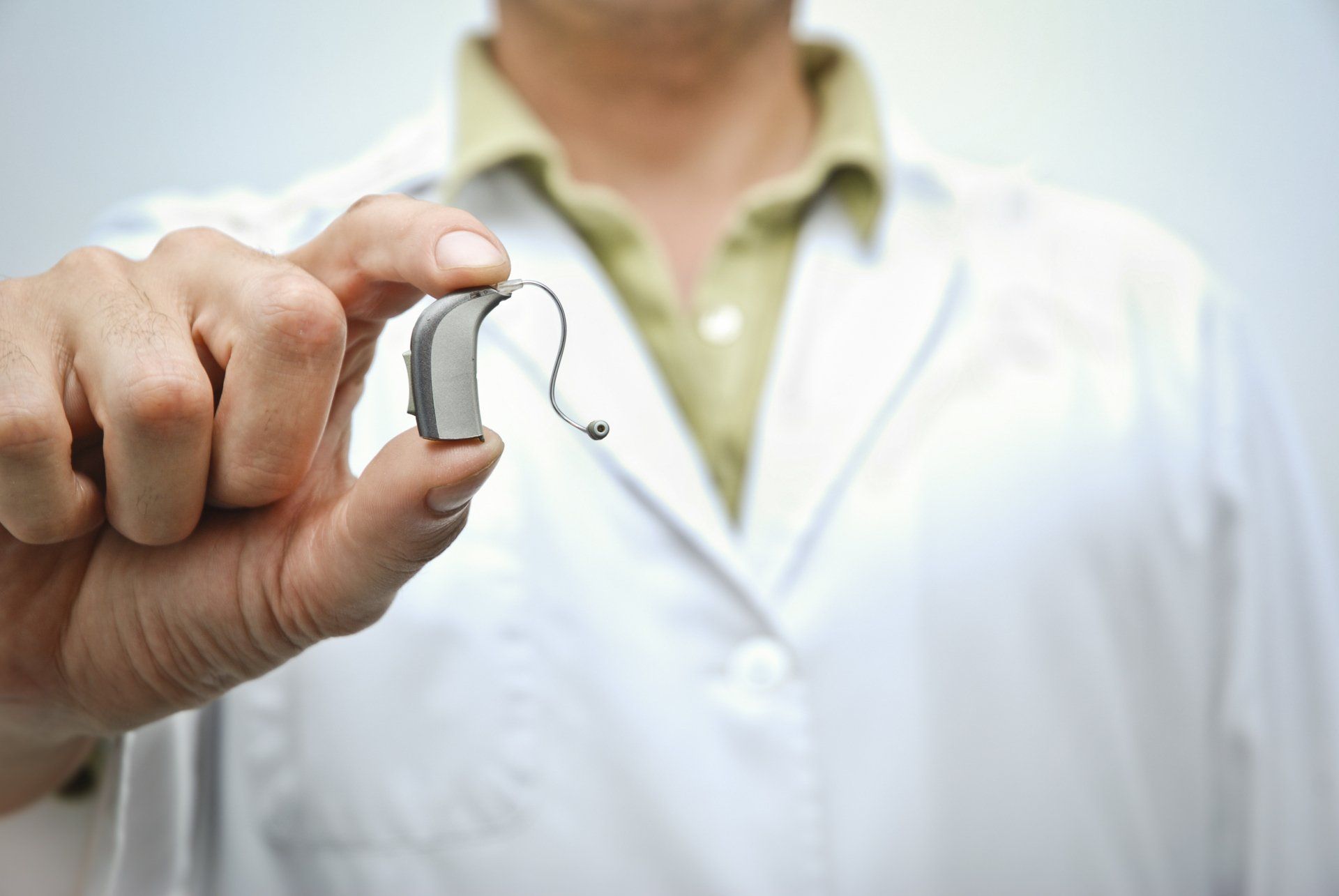 Doctor Showing Hearing Aid — Conway, AR — Arkansas Hearing Aids
