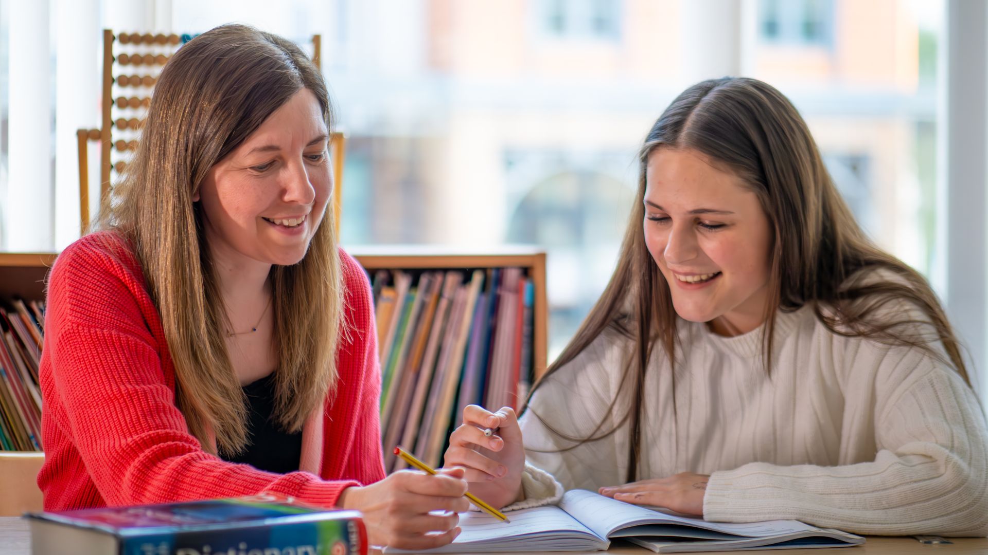 lady tutor with girl student