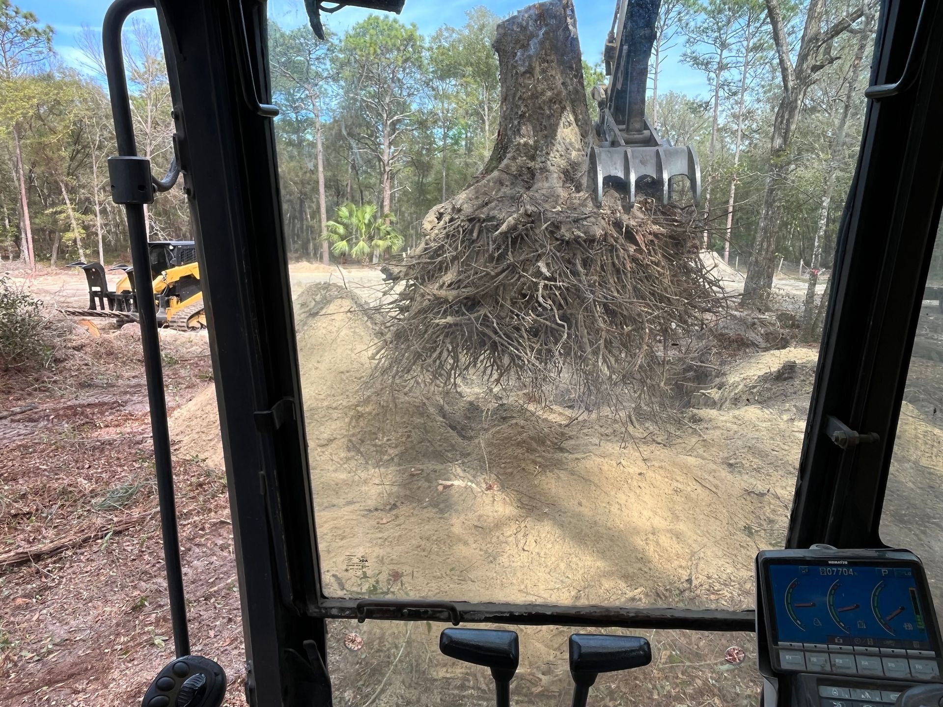 tree stump removal with excavator