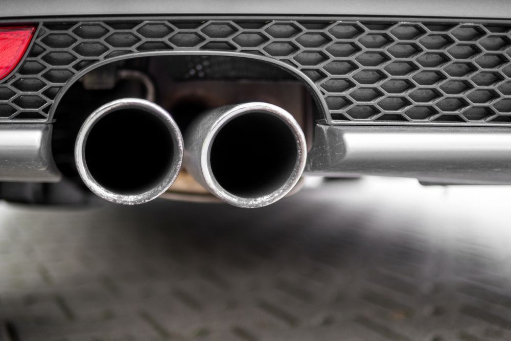 A Close Up Of The Exhaust Pipes Of A Car — Airlie Beach Exhaust and Mechanical In Airlie Beach, QLD