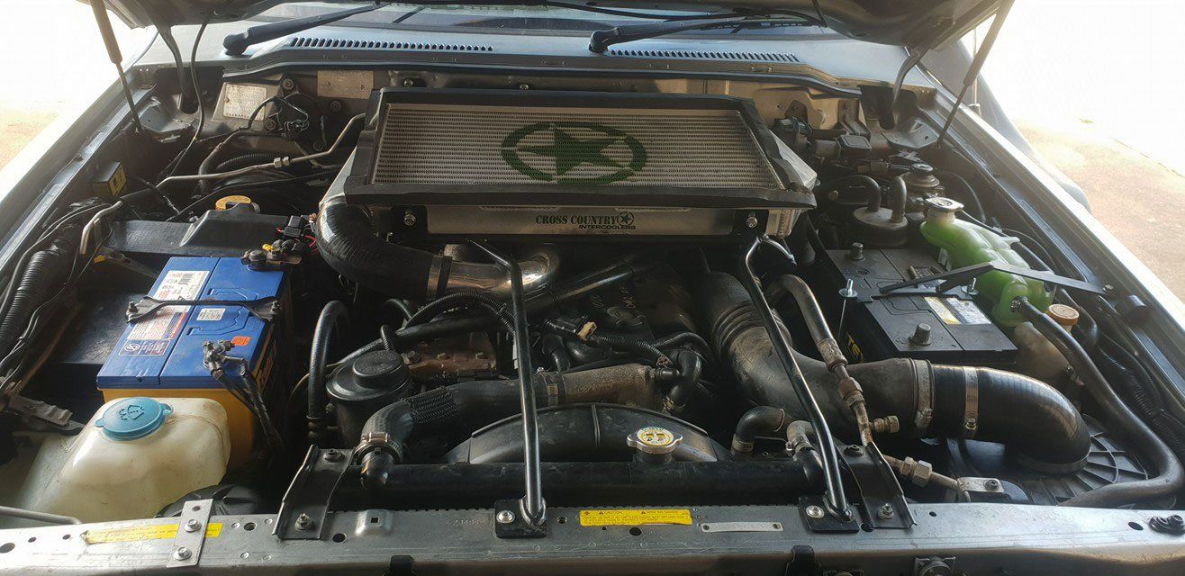 Cross Country Intercoolers Radiator On The Top Of Car Engine — Airlie Beach Exhaust and Mechanical In Cannonvale, QLD