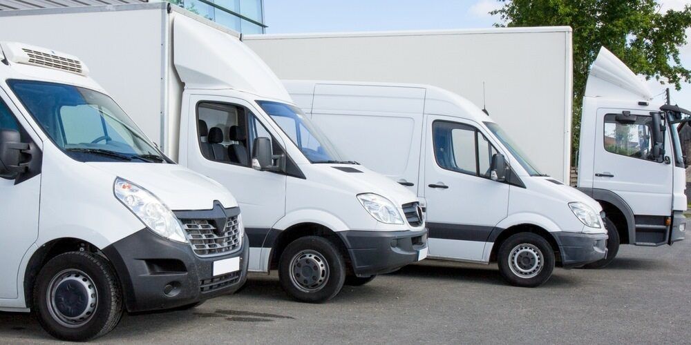 Three White Vans Are Parked Next to Each Other in a Parking Lot — Airlie Beach Exhaust and Mechanical In Bowen, QLD