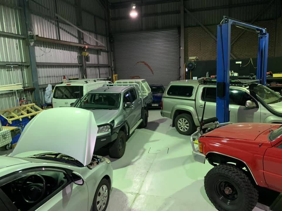 Vehicles Inside a Garage, Including a Silver Pickup Truck — D.A.G Automotive in Unanderra, NSW