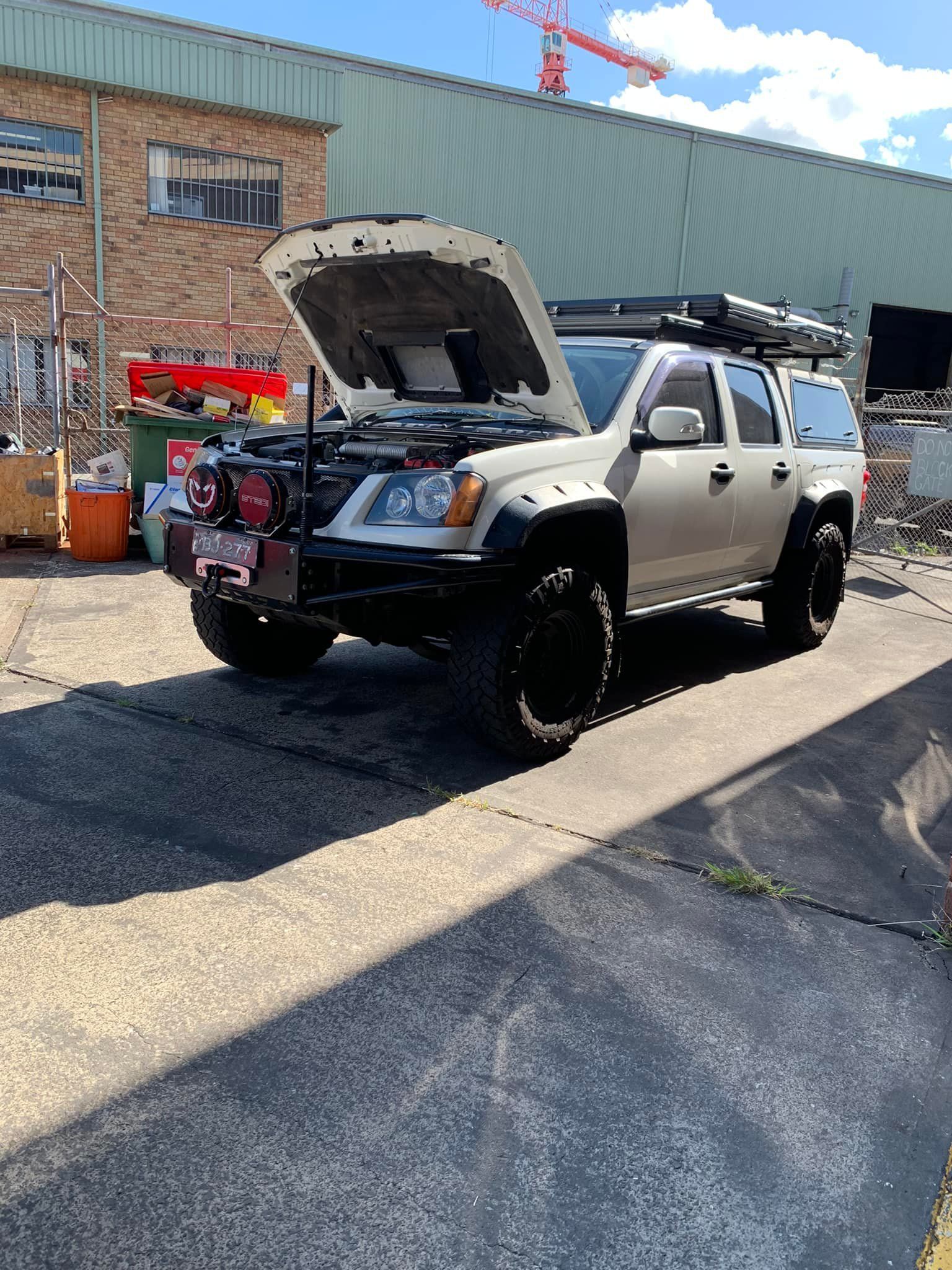 White Off-road Truck With Open Hood — D.A.G Automotive in Unanderra, NSW