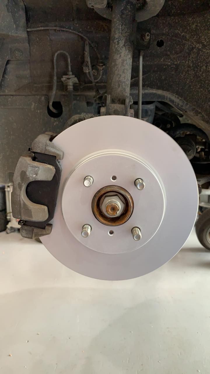 New Silver Brake Rotor on a Car Wheel — D.A.G Automotive in Unanderra, NSW