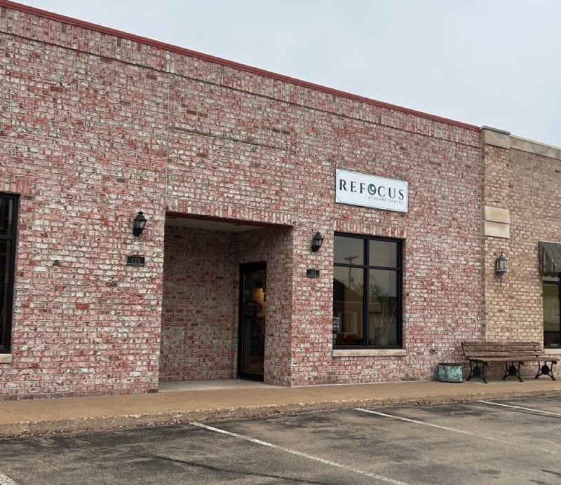 A large brick building with a sign that says hibiscus on it.