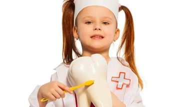 young girl with braces in a dental surgery