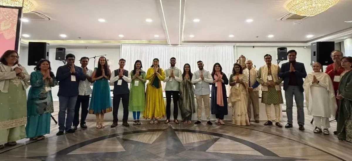 Members of the Diwali in London Committee 2026 standing together in namaste