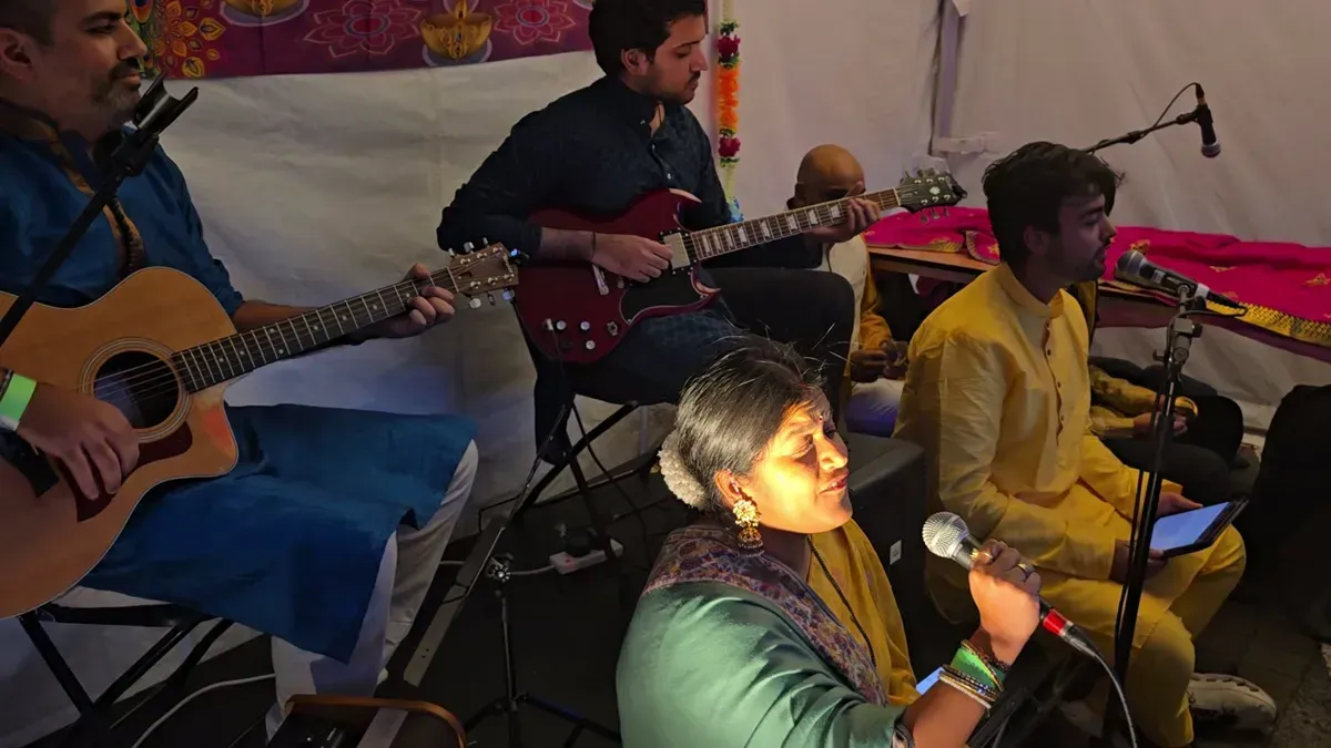 A singer and guitarists performing in the Bhajan Zone